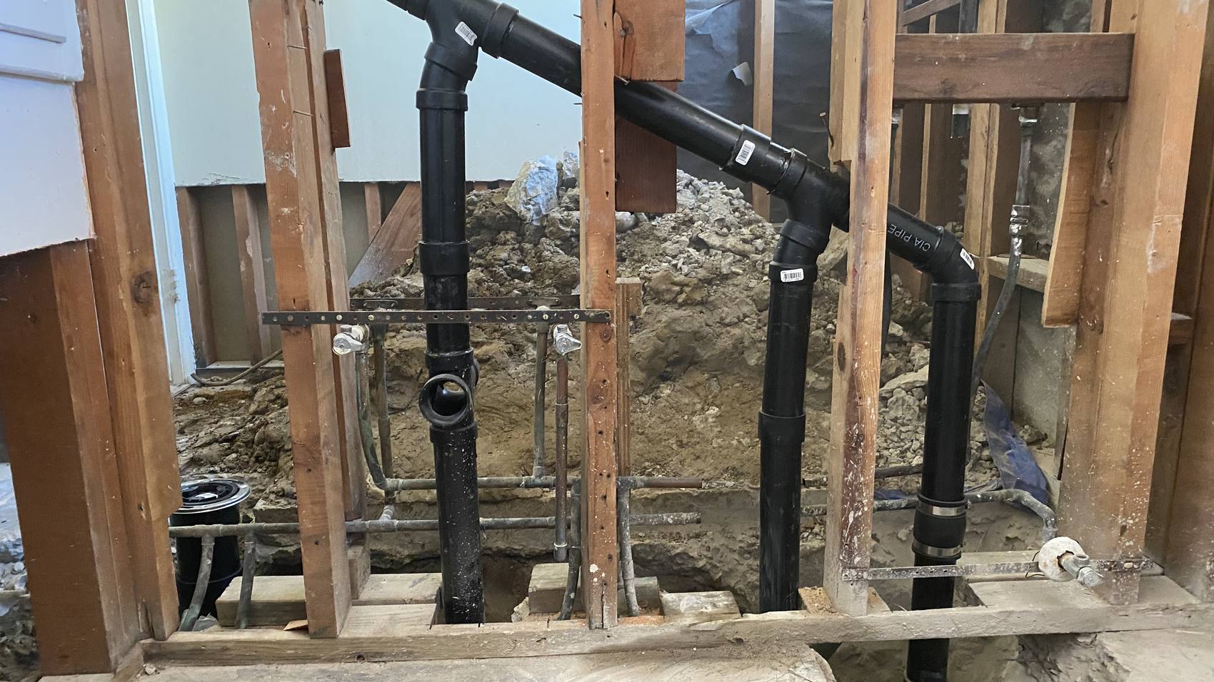 New ABS drain and waste stacks installed during a C3 whole-house repipe